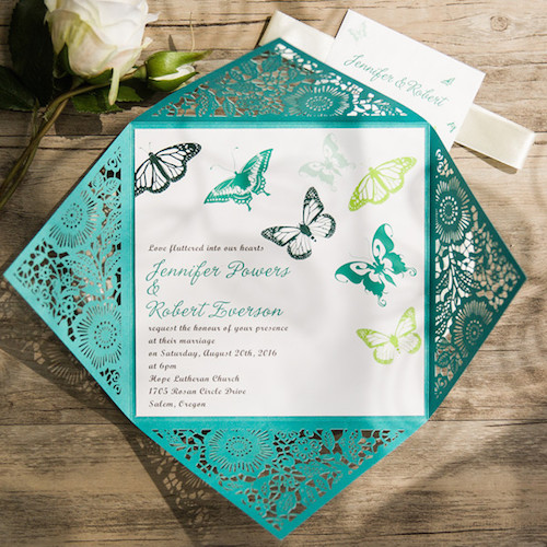 Laser cut wedding invites with butterflies.