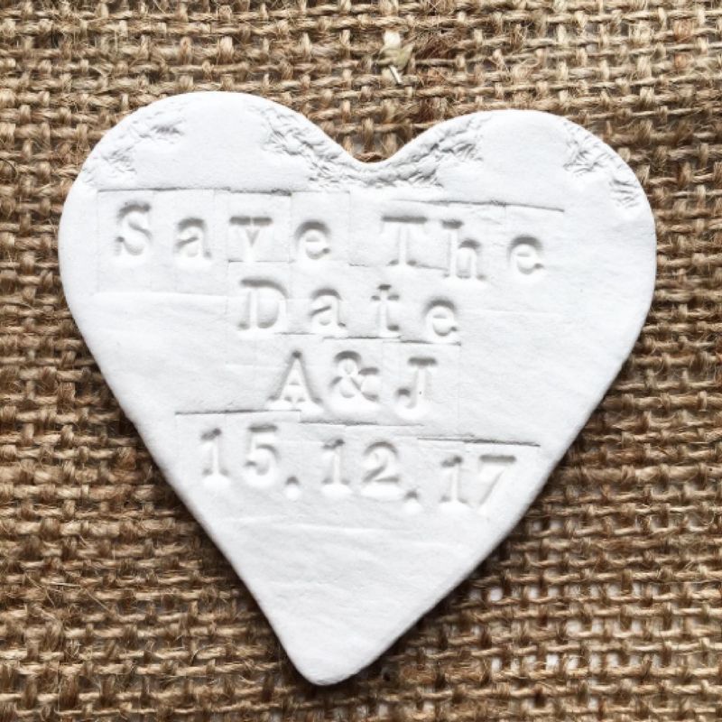 White heart save the date magnet.